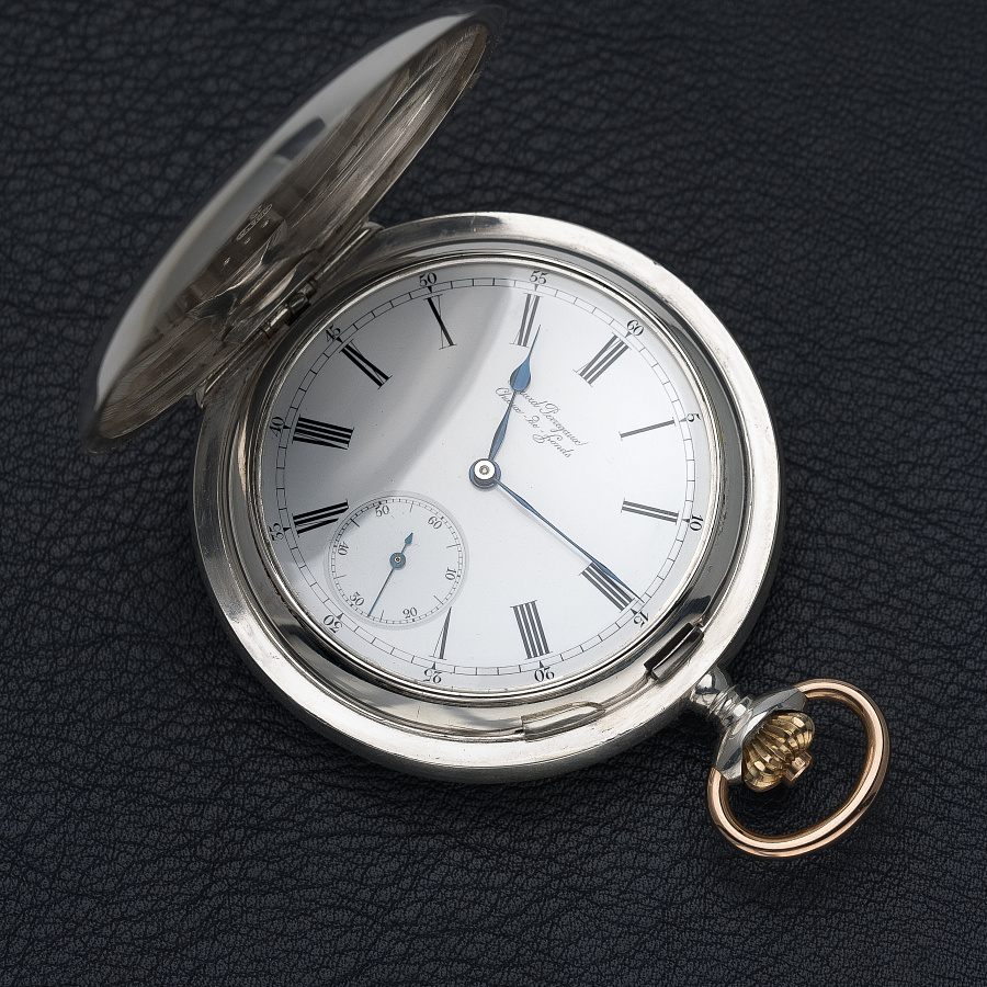 Silver Pocket Watch with a Triple Bridge Movement